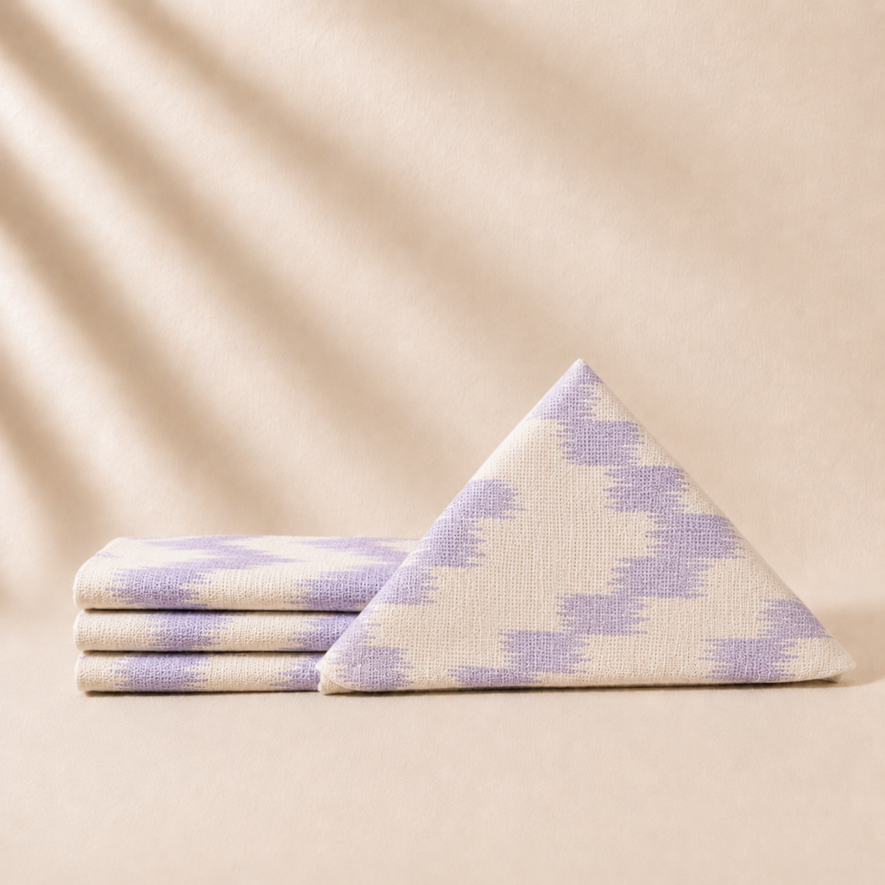 Napkins with purple and white pattern on a beige background