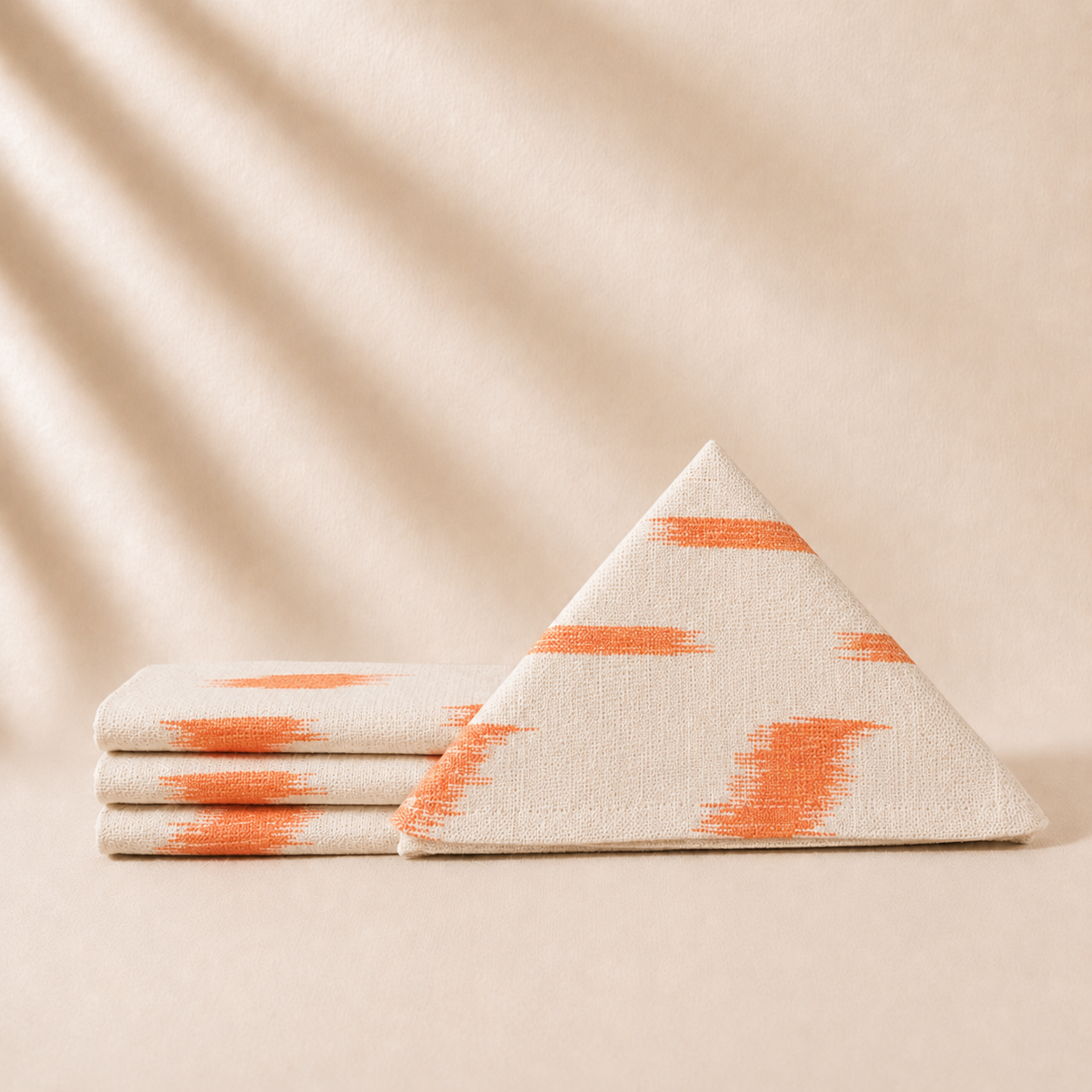 Set of napkins with orange patterns on a beige background