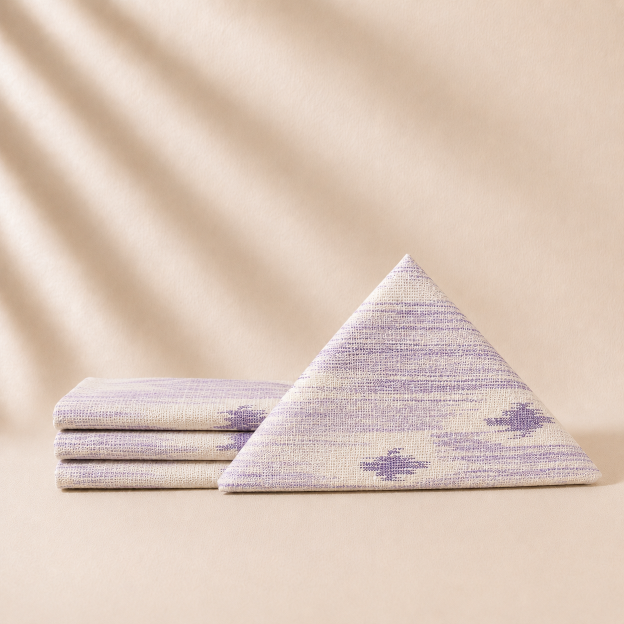 Set of napkins with purple patterns on a beige background