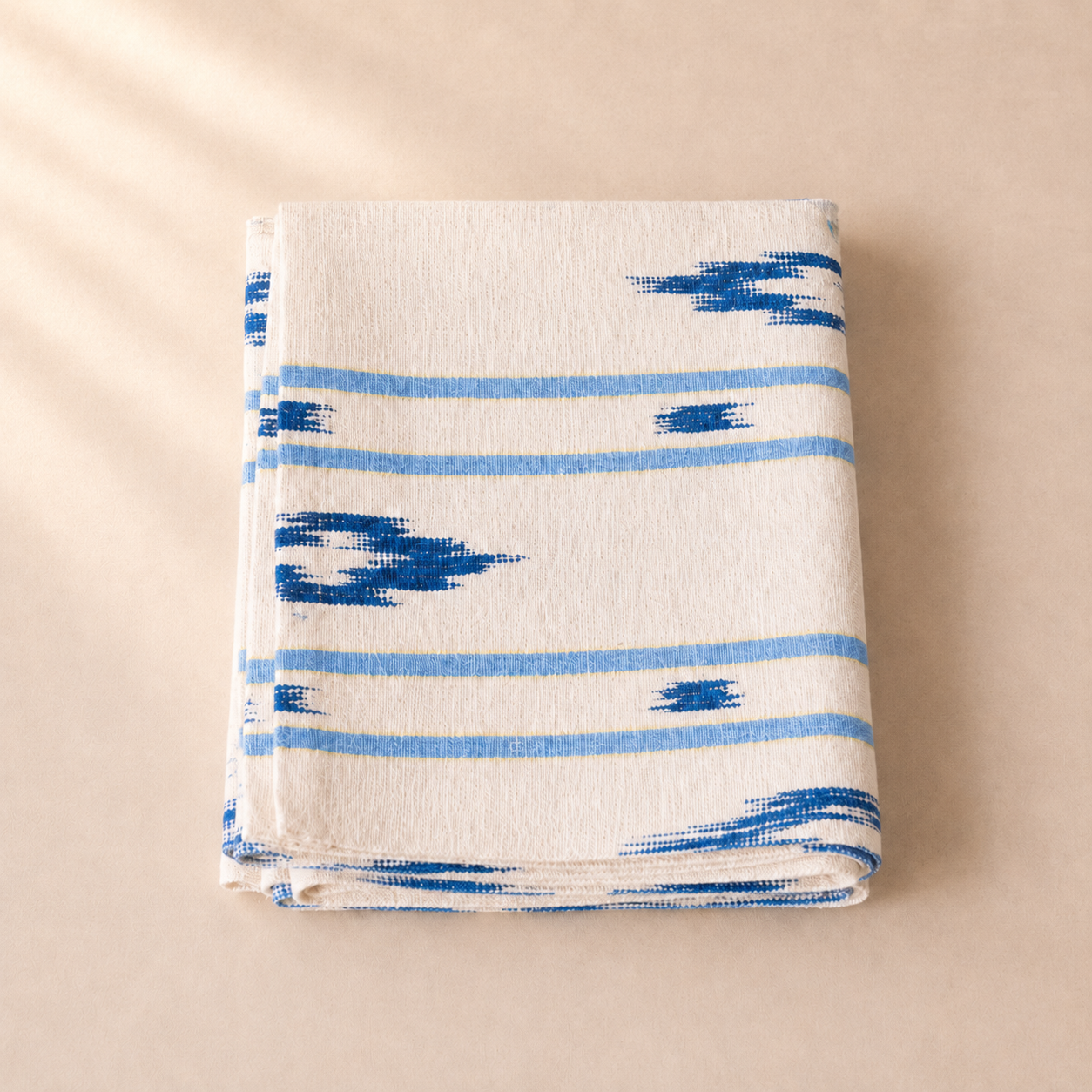 Table runner with blue geometric patterns on a beige background