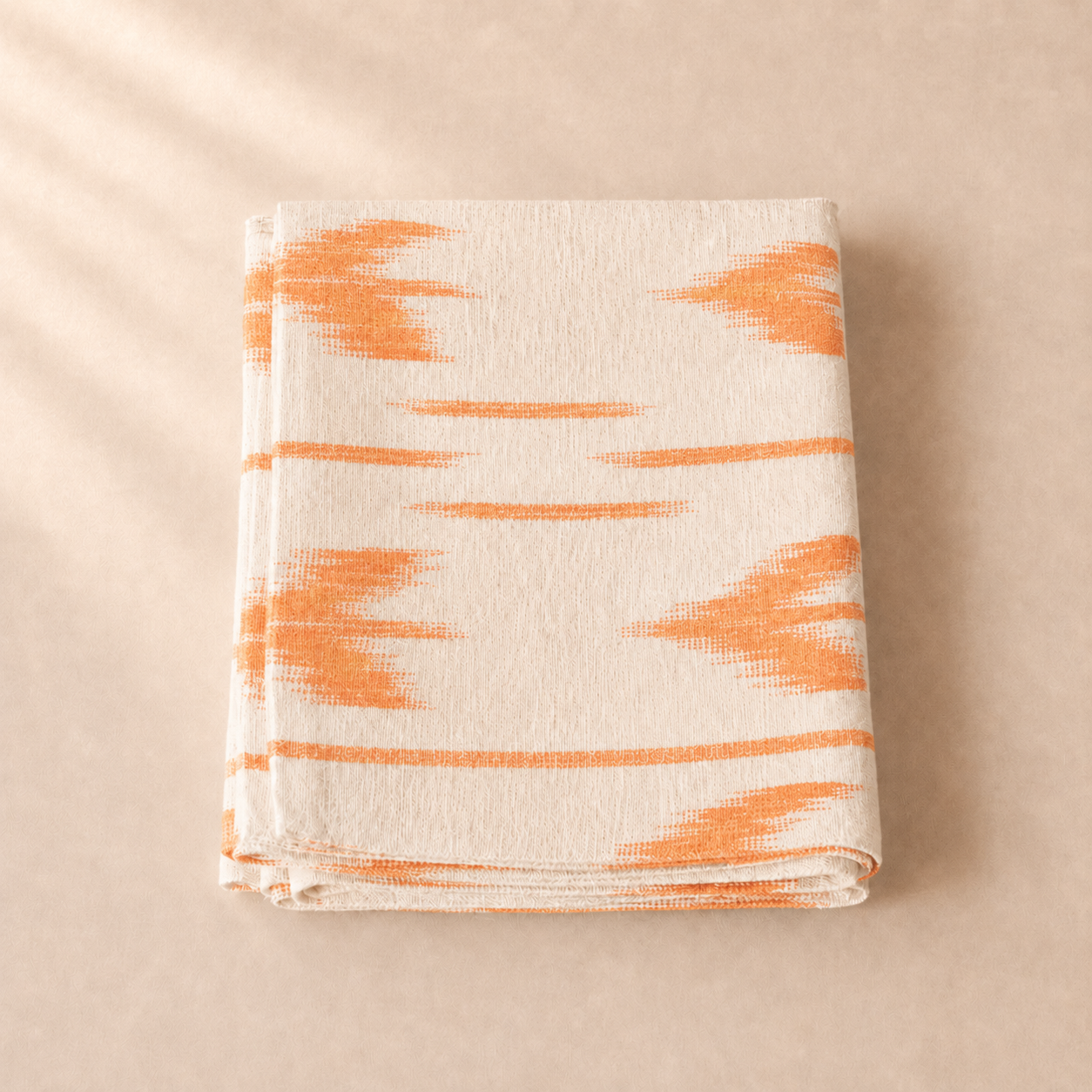 Table runner with orange abstract pattern on a beige background