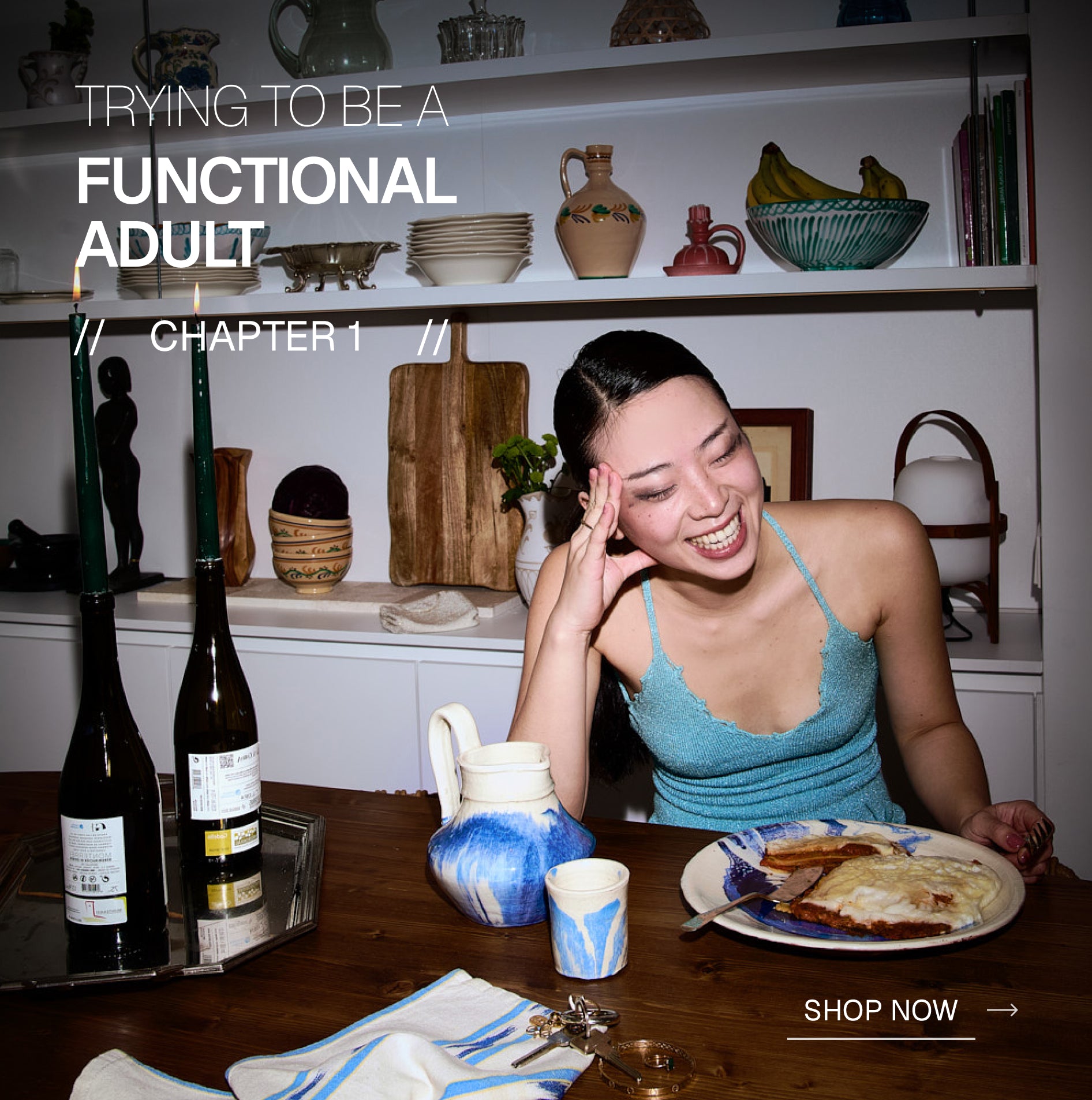 Woman sitting at a table with food and wine, with text overlay about being a functional adult.