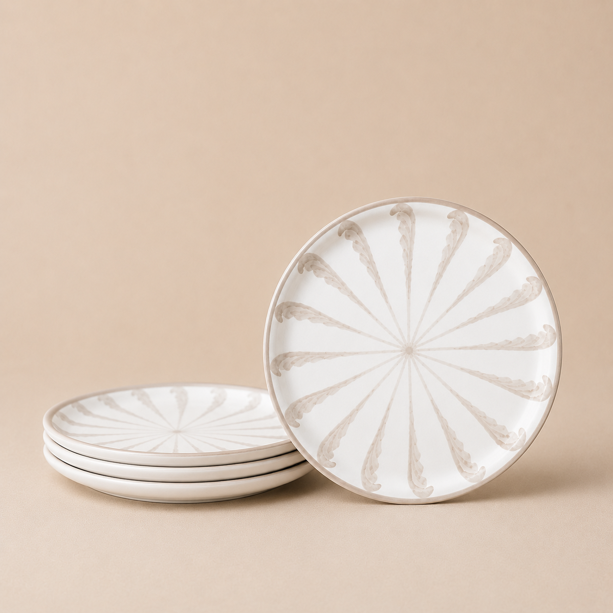 Set of ceramic plates with decorative patterns on a beige background
