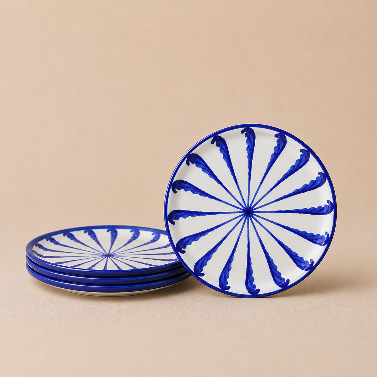 Set of blue and white decorative plates on a beige background