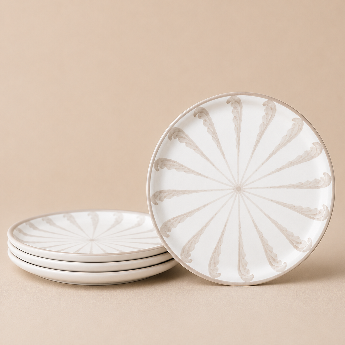 Set of ceramic plates with decorative pattern on a beige background