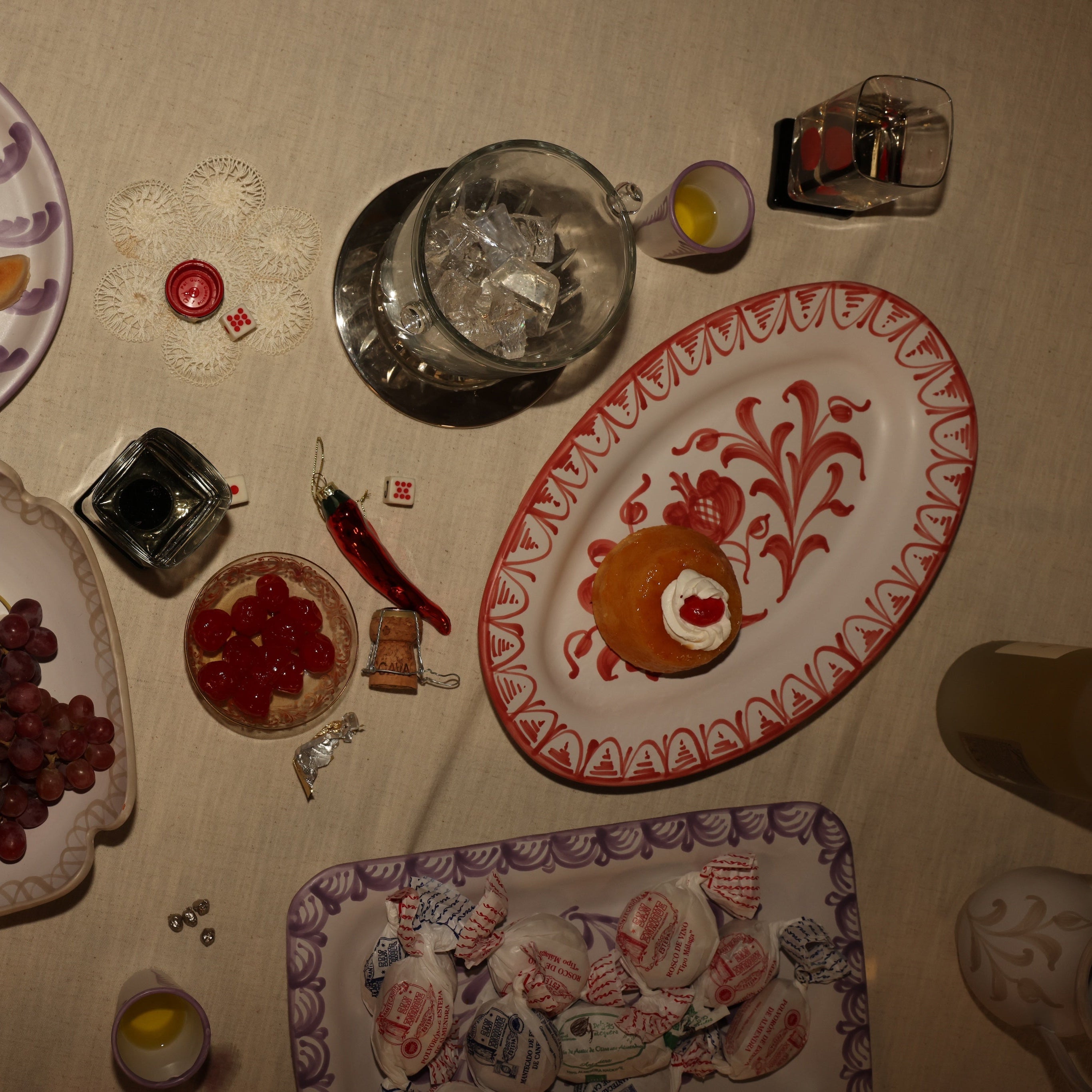 Decorative plates with fruit and a pitcher on a tablecloth - lifestyle