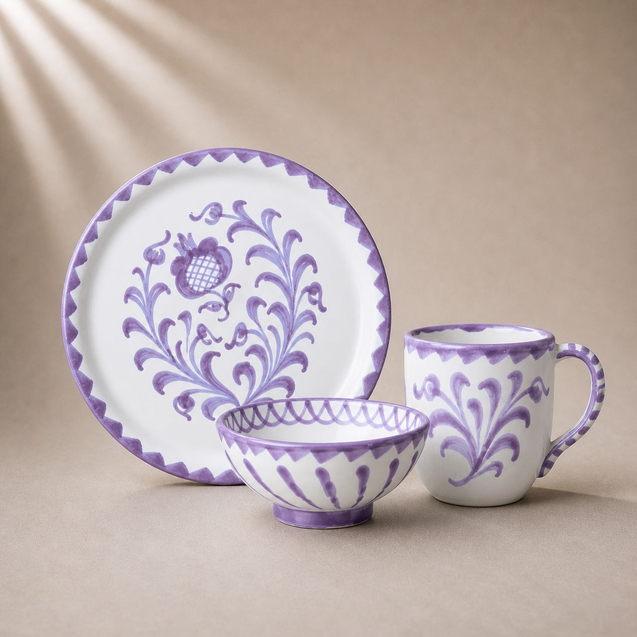 Ceramic tableware set with purple floral patterns on a beige background