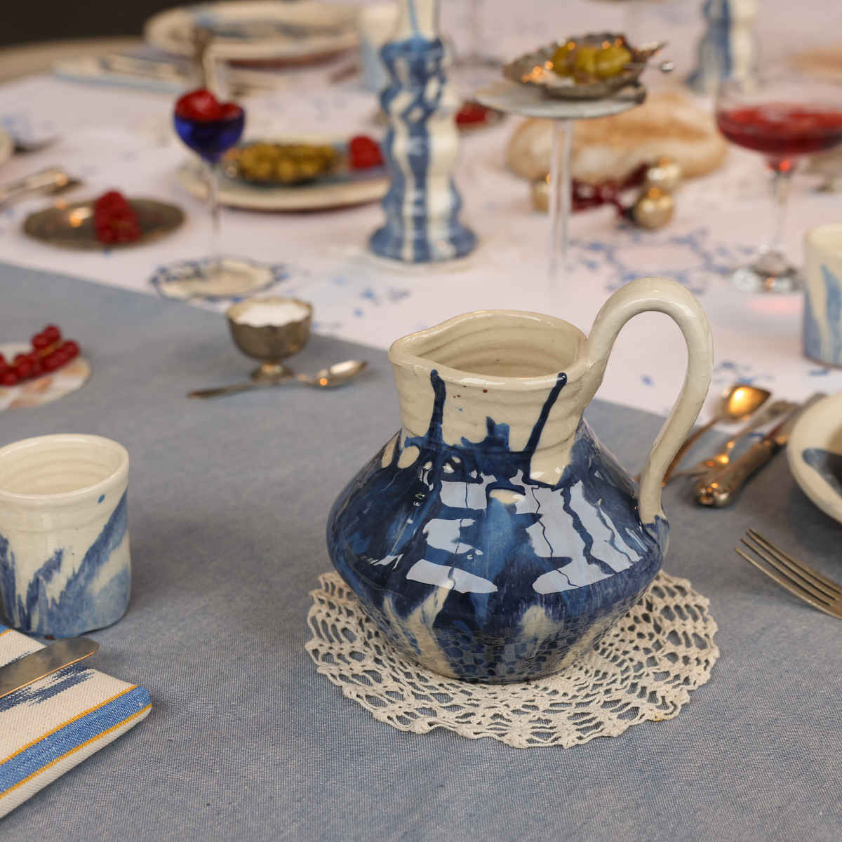 Blue pitcher from Huelva set on a table - lifestyle