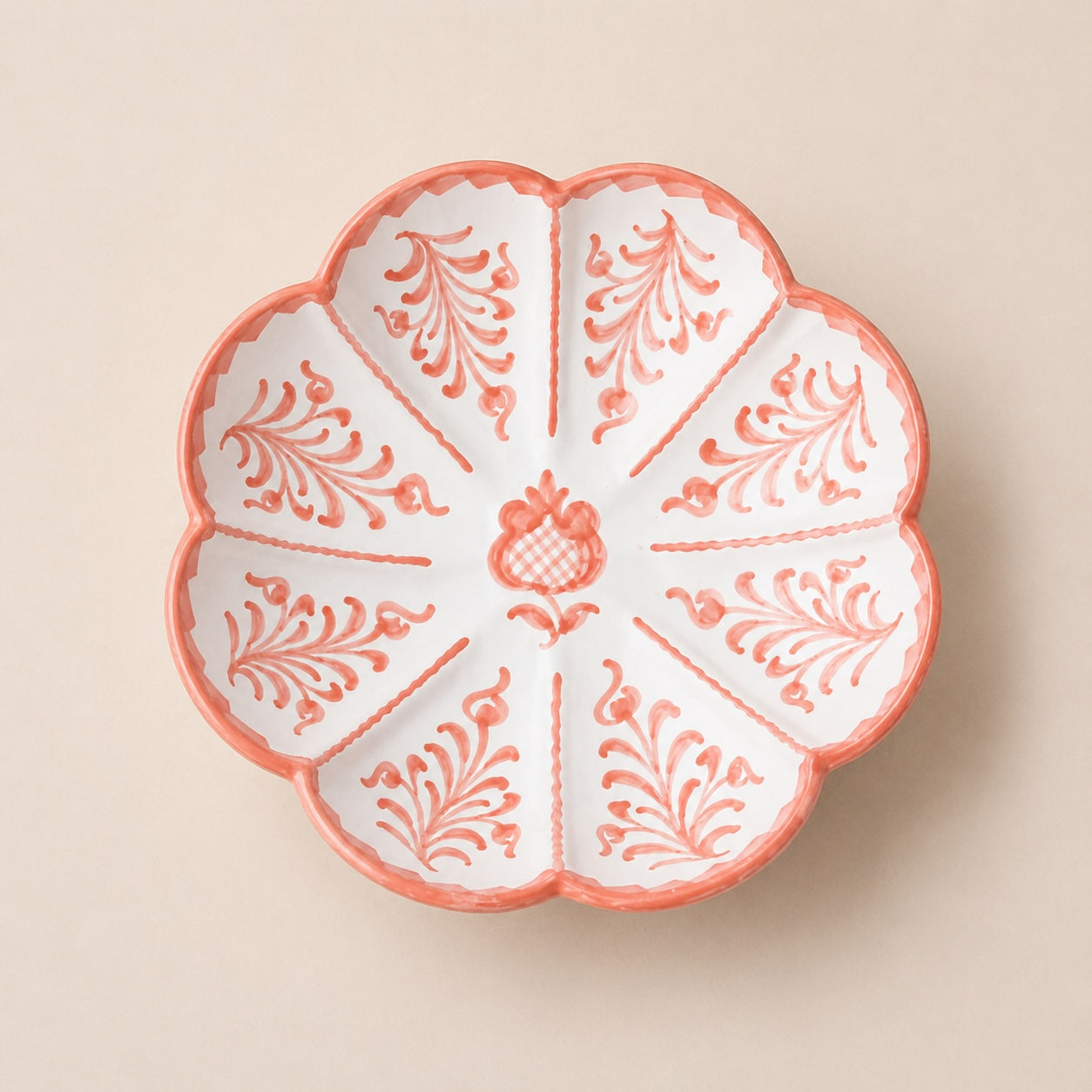 Decorative ceramic plate with floral patterns on a beige background