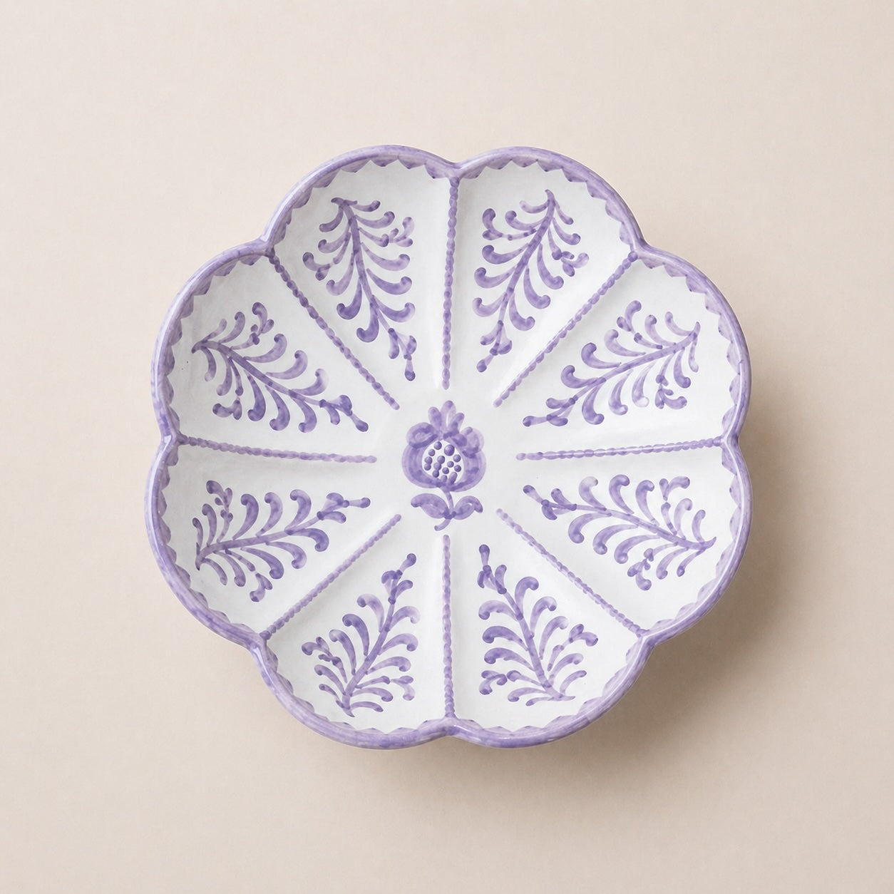 Decorative plate with purple floral patterns on a beige background