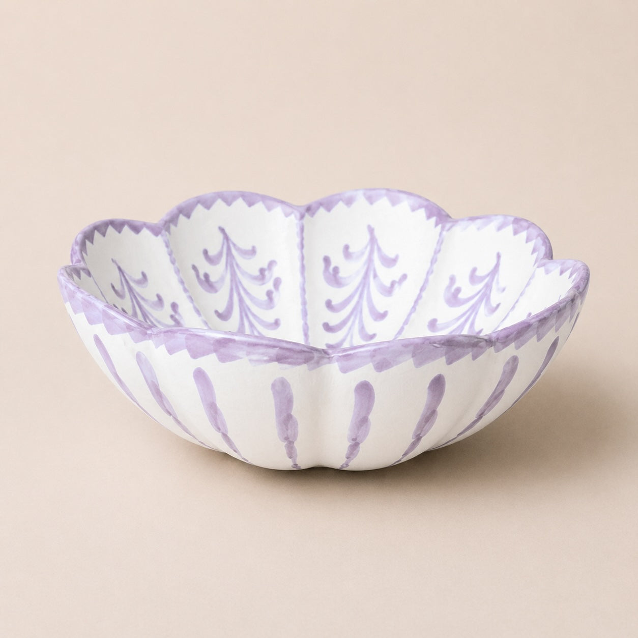 Decorative bowl with purple patterns on a beige background