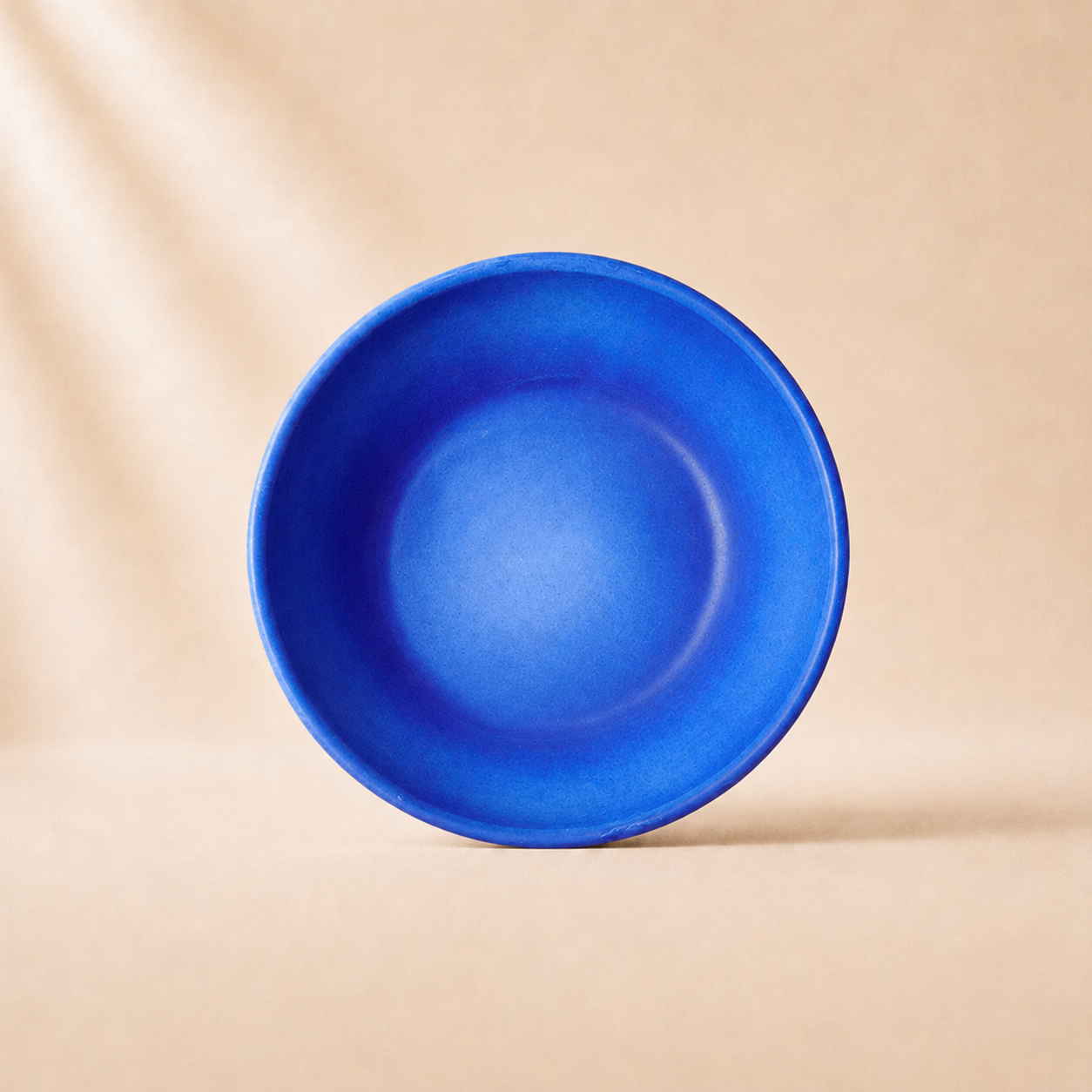 Blue monochrome pasta bowl on a beige background