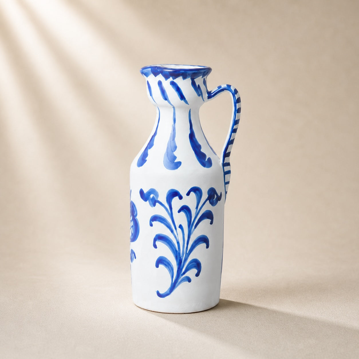 Ceramic vase with blue floral patterns on a beige background