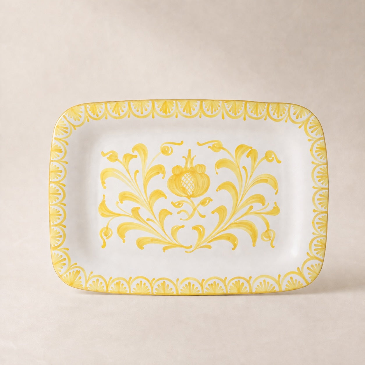Rectangular plate with yellow floral pattern on a beige background