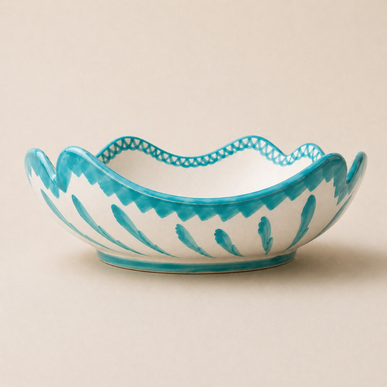 Ceramic bowl with blue decorative pattern on a beige background