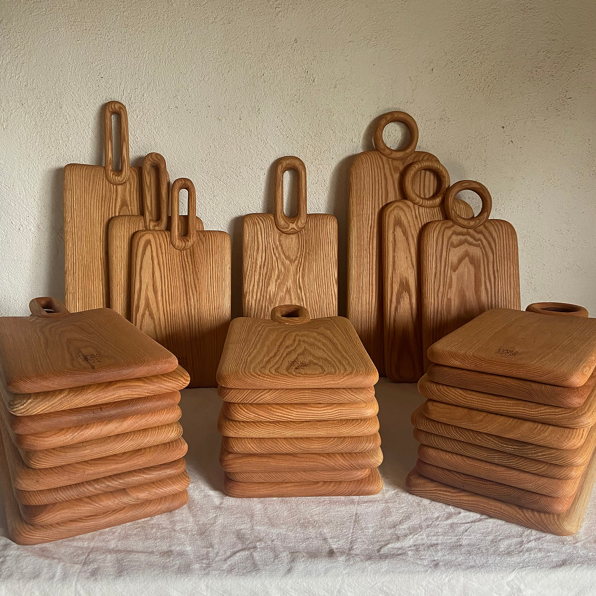 Set of wooden cutting boards and containers on a light background - lifestyle