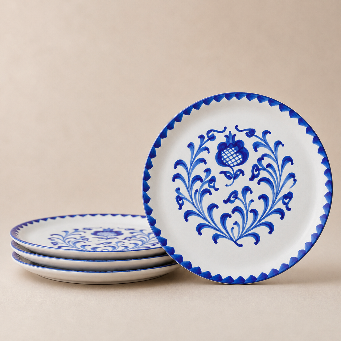 Set of ceramic plates with blue floral patterns on a beige background