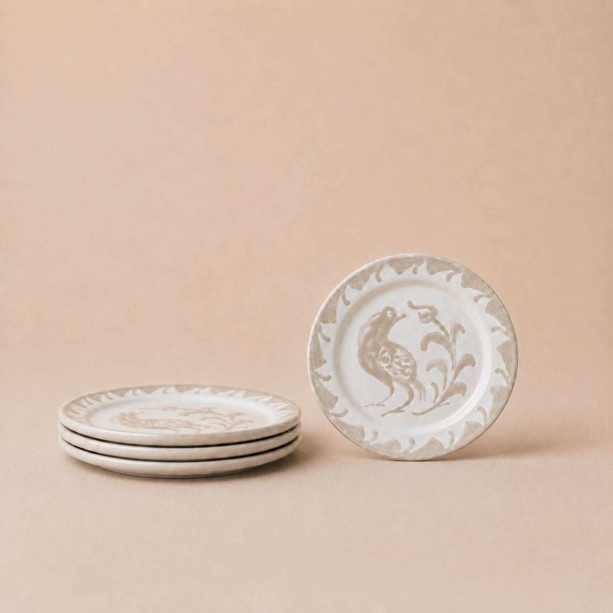 Set of ceramic plates with decorative patterns on a beige background