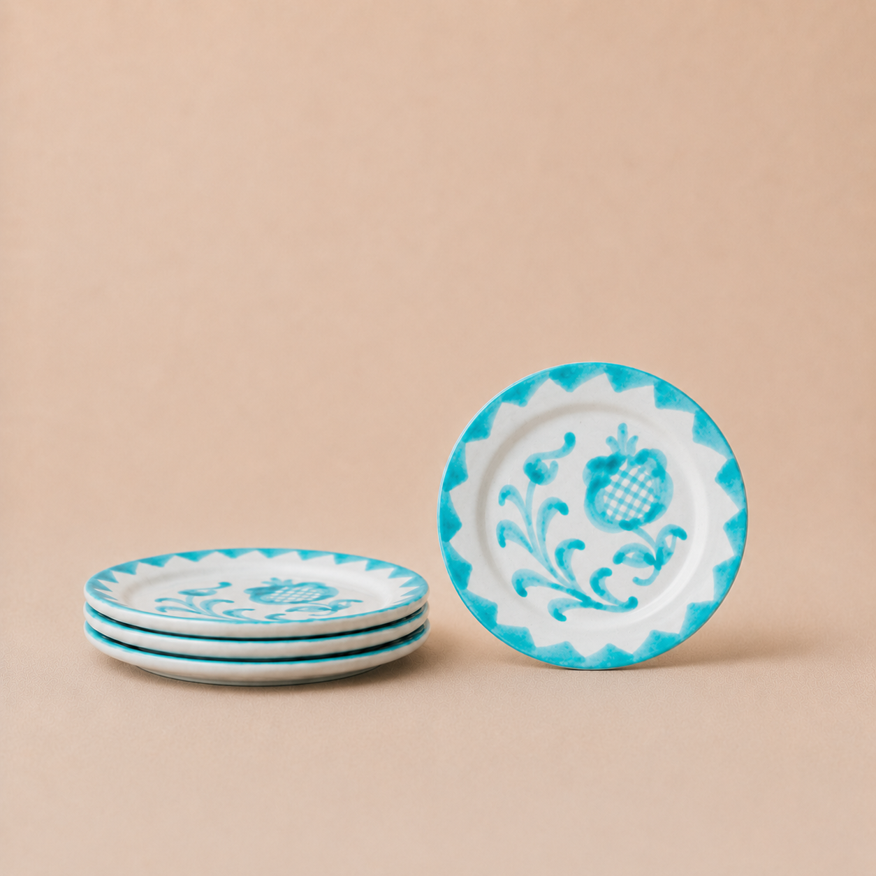 Set of decorative plates with blue and white patterns on a beige background