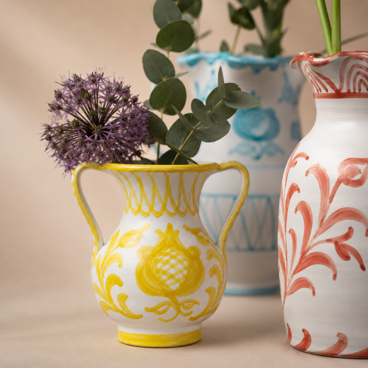 Four decorative vases with floral patterns on a black background - lifestyle