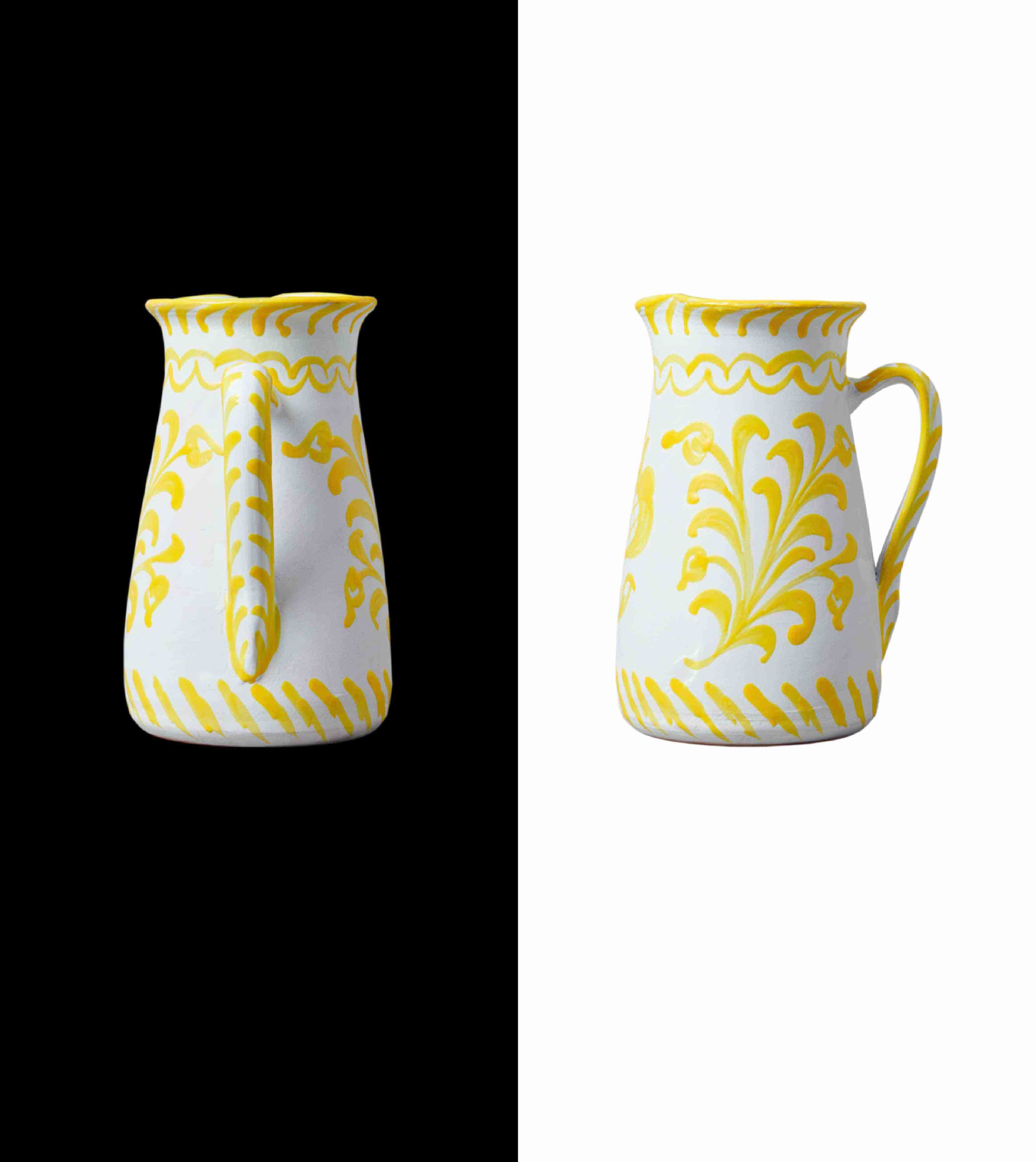 013 wide pitcher with traditional design made for cold bear, but we love it for fresh flowers, lemonade, or gazpacho. Handcrafted by traditional artisans in Granada yellow